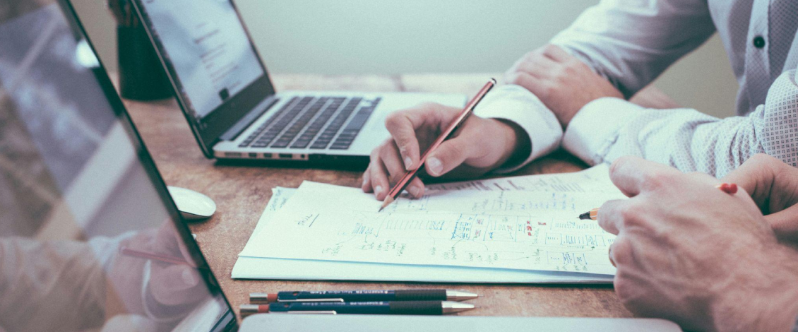 Financial services executive search team reviewing leadership market data